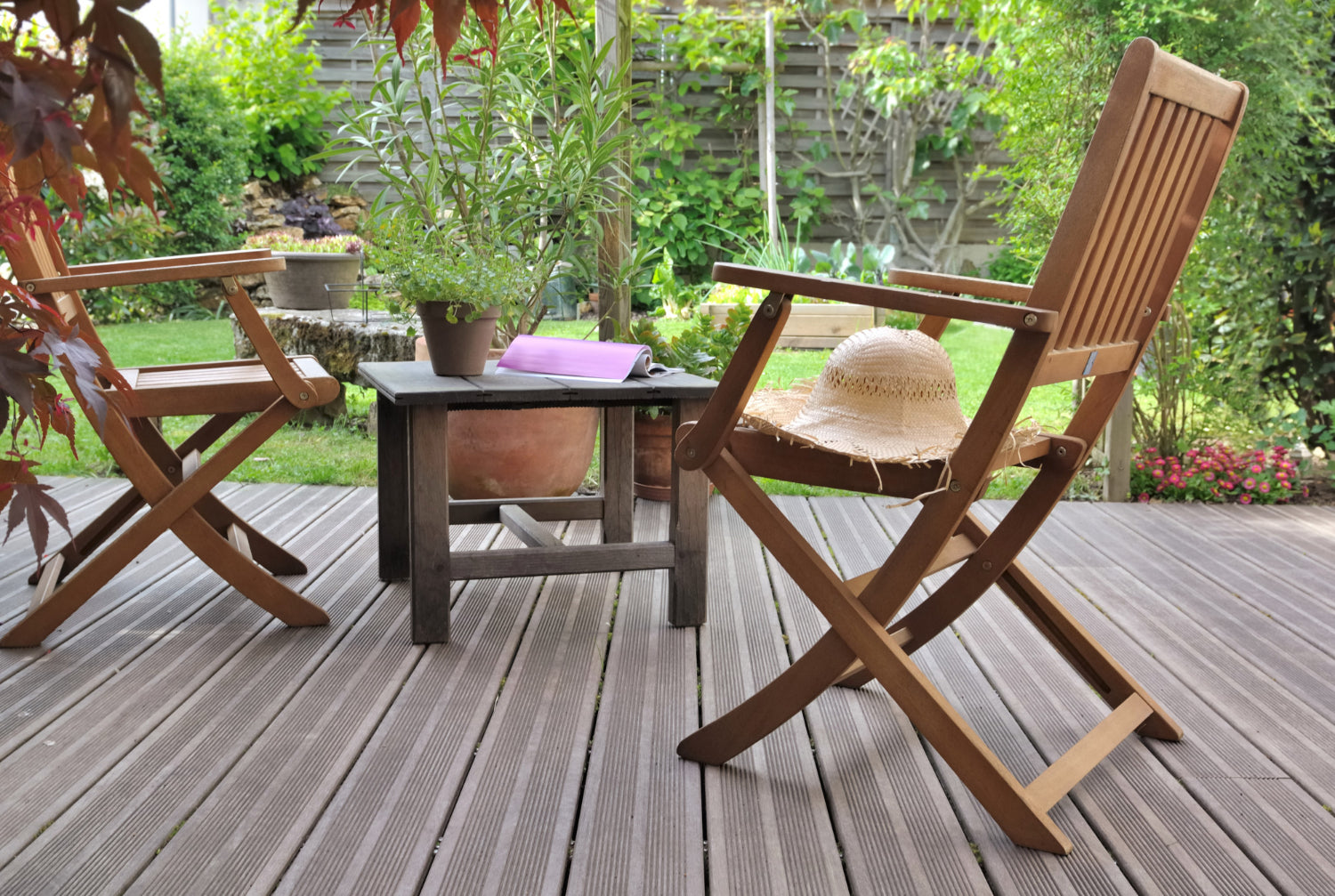 Two wooden chairs on composite deck