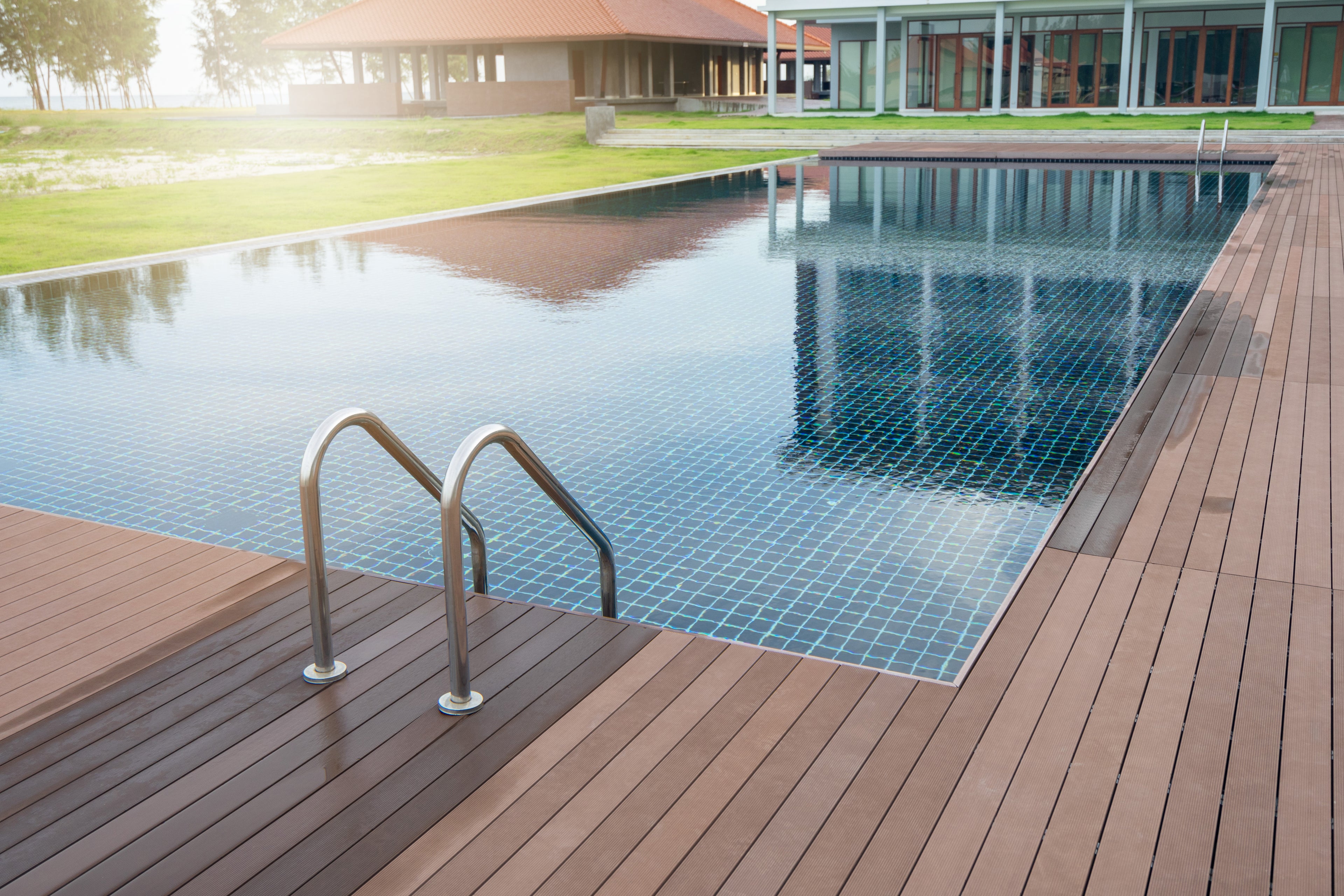 deck installed around swimming pool by the ocean